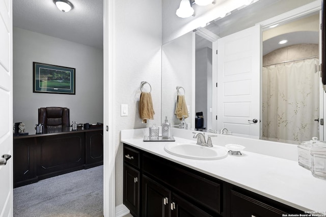 bathroom featuring vanity and a textured ceiling