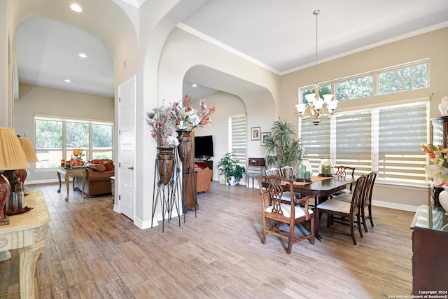 dining room featuring ornamental molding and a notable chandelier