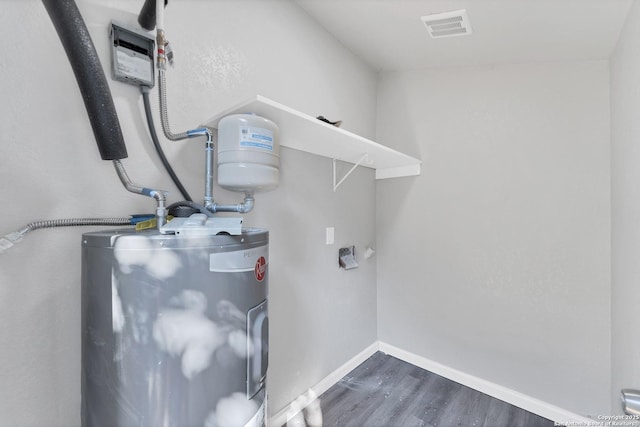 utility room with electric water heater