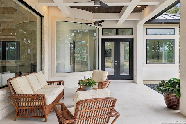 property entrance with a patio area, ceiling fan, french doors, and outdoor lounge area