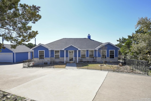 single story home with a garage and an outdoor structure