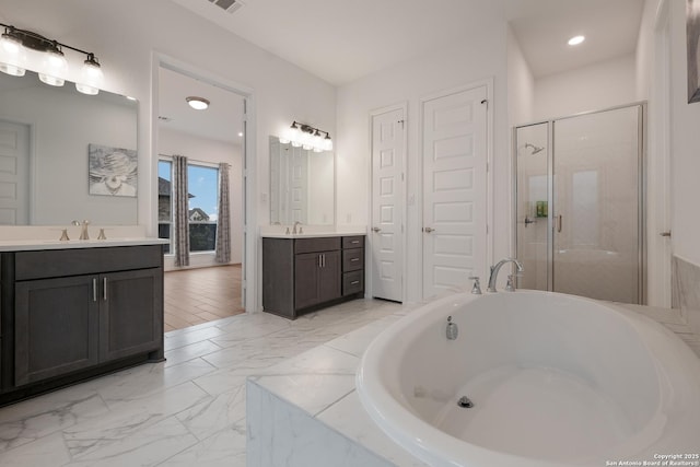 bathroom with vanity and plus walk in shower