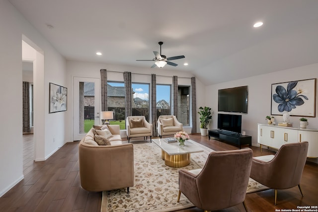 living room featuring vaulted ceiling and ceiling fan