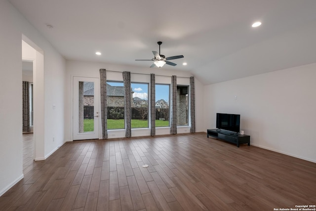 unfurnished living room featuring ceiling fan and vaulted ceiling