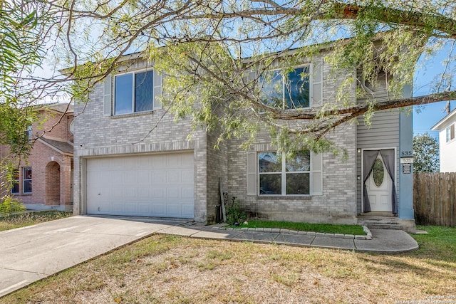 view of front of house with a front yard and a garage