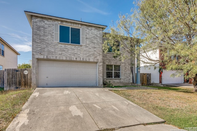 front facade featuring a front lawn and a garage