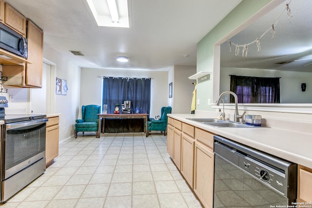 kitchen with electric range, light brown cabinets, black dishwasher, and sink