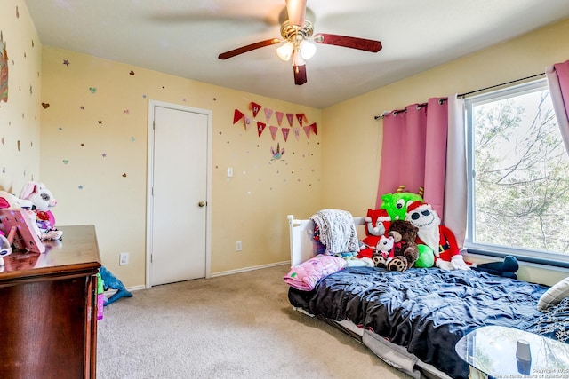 bedroom featuring ceiling fan and light colored carpet