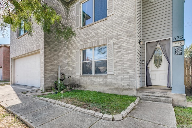 doorway to property featuring a garage