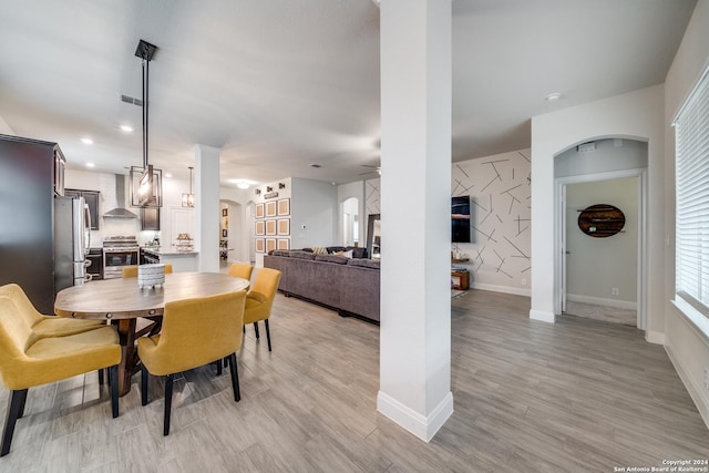 dining area with light wood-type flooring