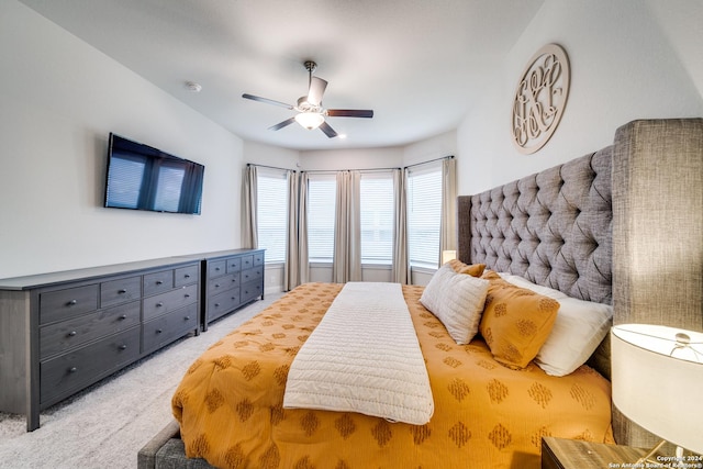 bedroom featuring ceiling fan and light carpet