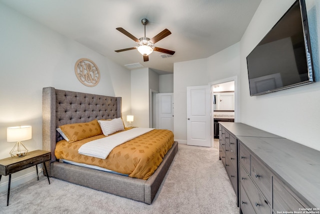 carpeted bedroom with ceiling fan and connected bathroom