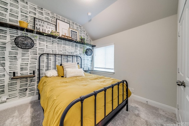 carpeted bedroom featuring vaulted ceiling