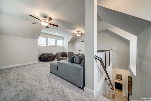 carpeted living room featuring lofted ceiling and ceiling fan