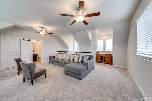 carpeted living room featuring lofted ceiling and ceiling fan