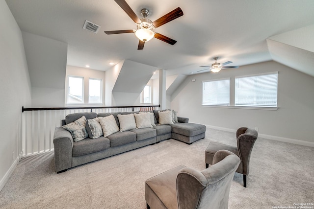 carpeted living room with lofted ceiling and ceiling fan