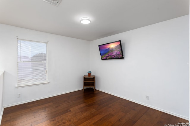 empty room featuring dark hardwood / wood-style floors