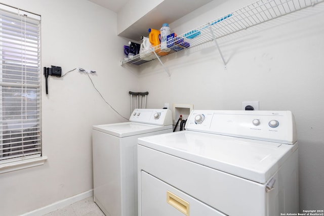 washroom featuring washer and clothes dryer