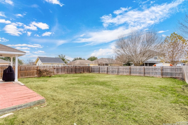 view of yard featuring a wooden deck