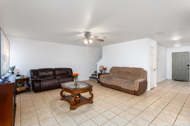 living room with light tile patterned flooring and ceiling fan