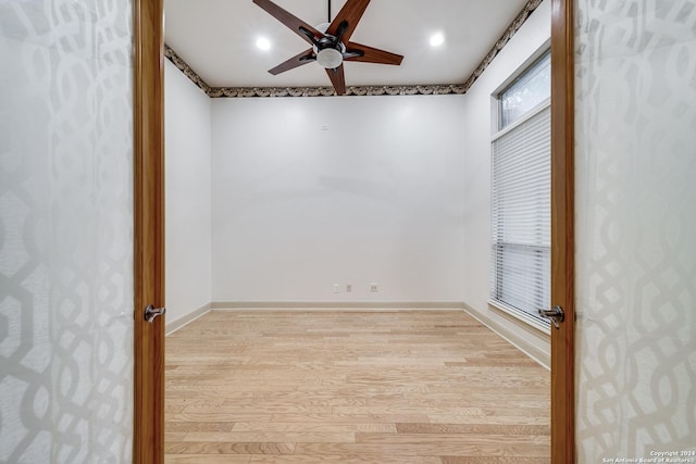 unfurnished room featuring ceiling fan and light hardwood / wood-style flooring