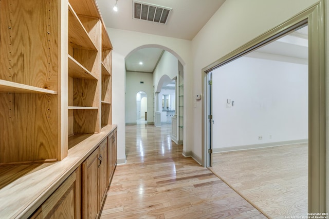 corridor featuring light hardwood / wood-style flooring