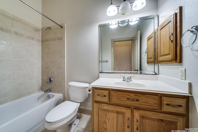 full bathroom featuring toilet, vanity, tile patterned floors, and tiled shower / bath combo