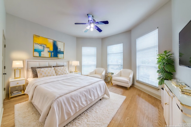 bedroom featuring ceiling fan and light hardwood / wood-style flooring