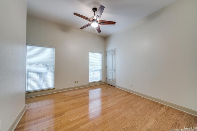 empty room featuring ceiling fan and light hardwood / wood-style flooring