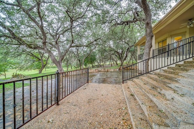 view of yard featuring ceiling fan