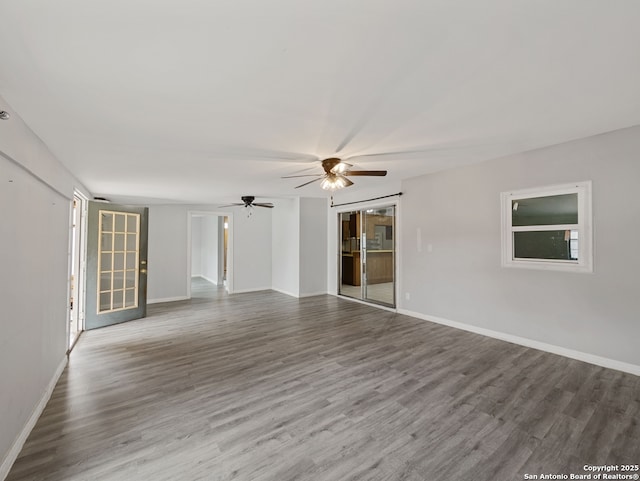 spare room with ceiling fan and hardwood / wood-style floors