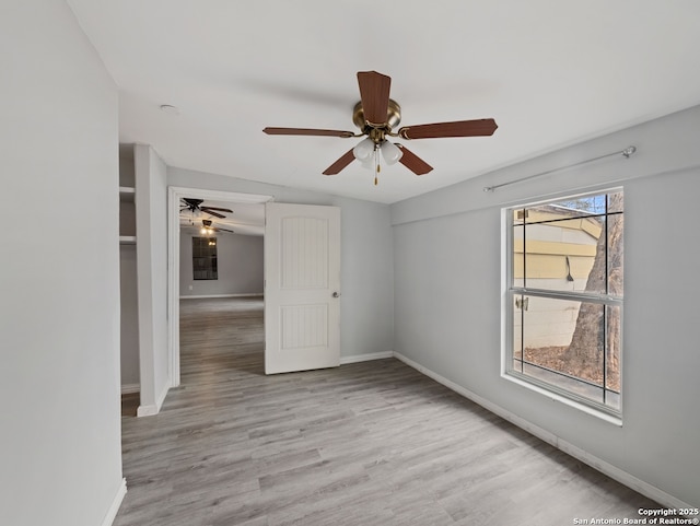 unfurnished room featuring ceiling fan and light hardwood / wood-style flooring