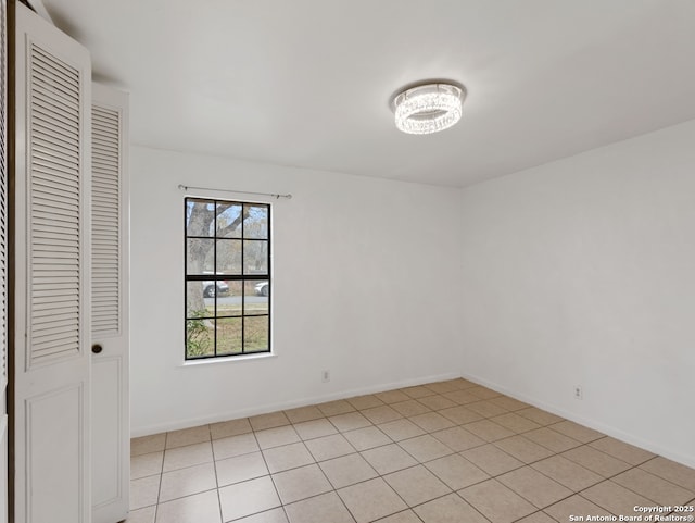 empty room featuring light tile patterned floors