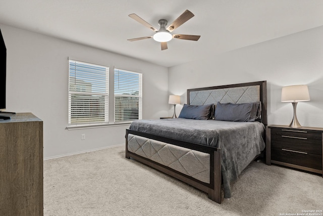 bedroom featuring light carpet and ceiling fan