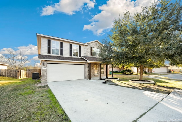 view of front property with a front yard, a garage, and central air condition unit