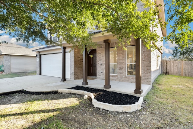 view of front of house featuring a front yard and a garage