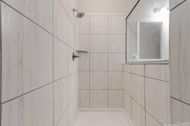 bathroom with tiled shower