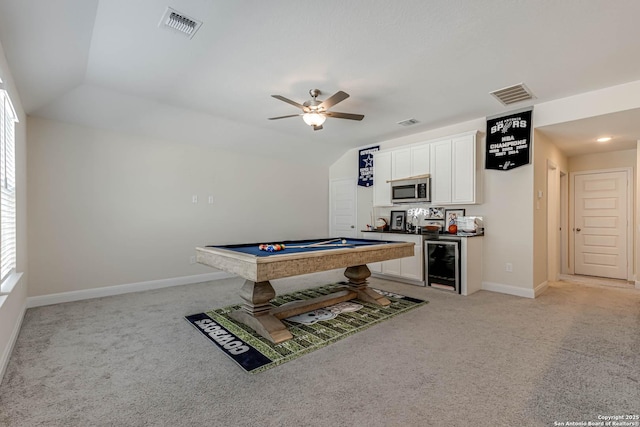 recreation room with vaulted ceiling, pool table, ceiling fan, wine cooler, and light colored carpet