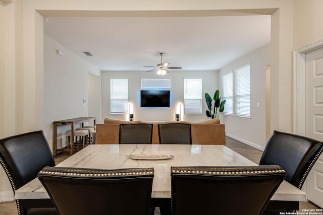 dining room featuring hardwood / wood-style flooring and ceiling fan