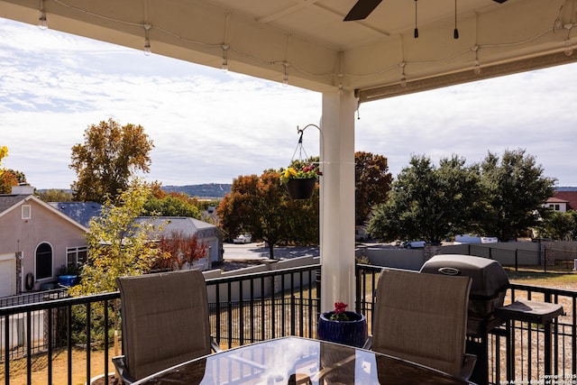 wooden deck with ceiling fan