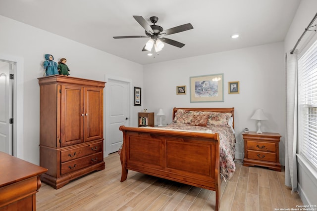 bedroom featuring ceiling fan and light hardwood / wood-style flooring