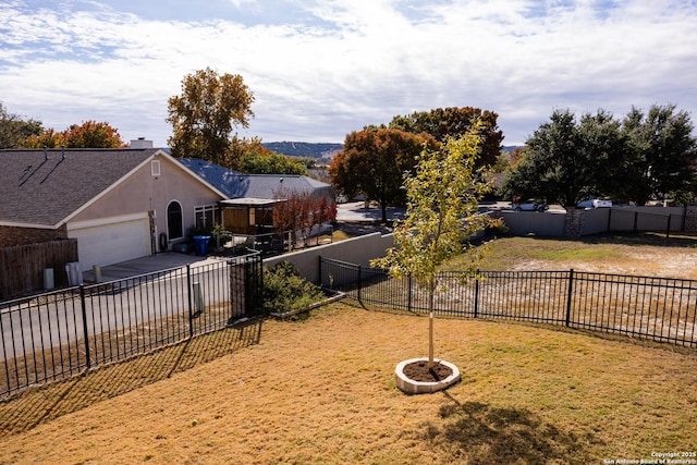 view of yard featuring a garage