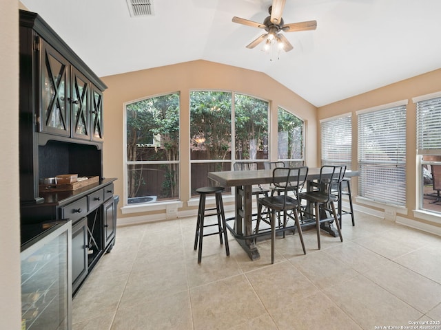 sunroom / solarium featuring ceiling fan and vaulted ceiling