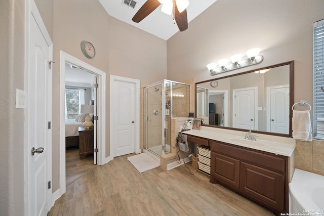 bathroom featuring vanity, ceiling fan, hardwood / wood-style flooring, and separate shower and tub