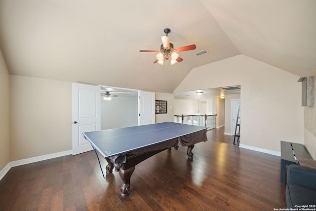 recreation room with vaulted ceiling, ceiling fan, and dark hardwood / wood-style floors