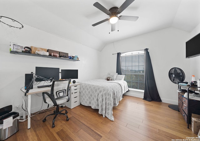 bedroom featuring lofted ceiling, ceiling fan, and hardwood / wood-style floors