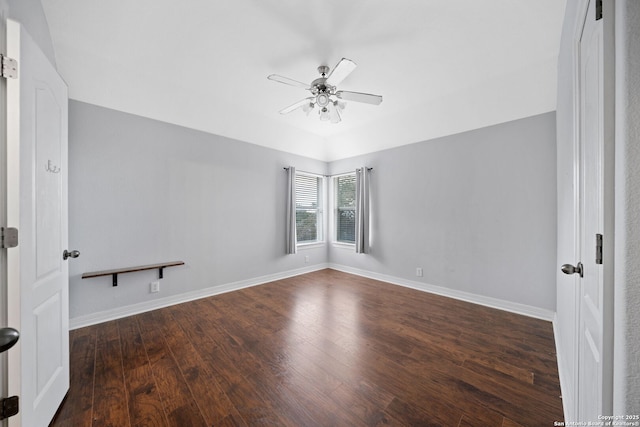 unfurnished room with ceiling fan and dark hardwood / wood-style flooring