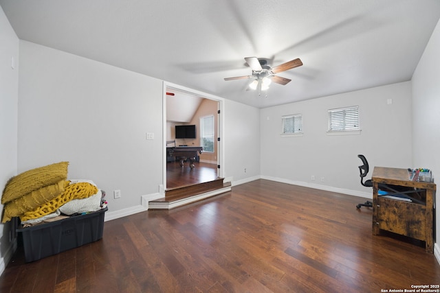 office area featuring ceiling fan, dark hardwood / wood-style flooring, and vaulted ceiling