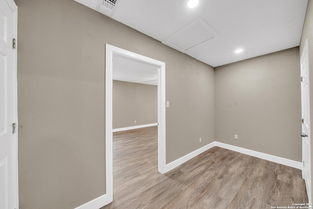 unfurnished room with light wood-type flooring