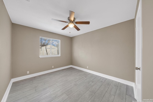 empty room featuring light wood-type flooring and ceiling fan